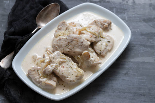 istock chicken with creamy sauce on dish on ceramic background 1204583657