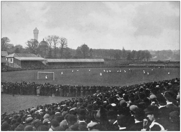 Antique photograph of the British Empire: Football game in England Antique photograph of the British Empire: Football game in England stadium photos stock illustrations