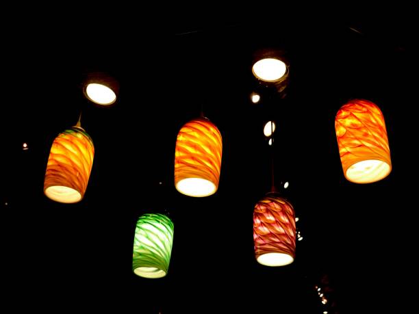 istock Artistic decorative lights hanging from the ceiling, dark background 1204586932
