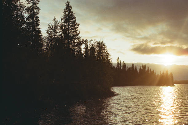 istock Scenic view of lake at sunset 1204591325