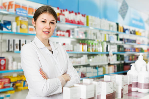 istock Female pharmacist in modern drugstore 1204591761