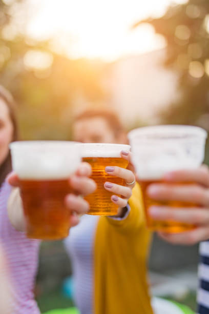 istock Friends enjoying drinking beer in the backyard. 1204592042
