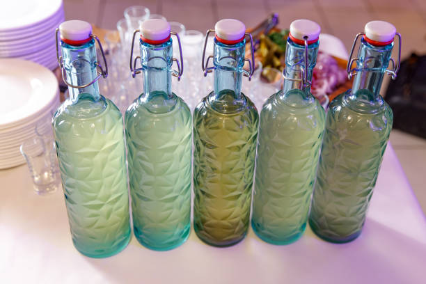 istock Row of homemade alcohol bottles. 1204594166