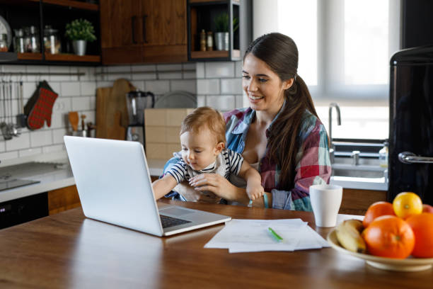 istock Young mother juggling work and child care 1204594342