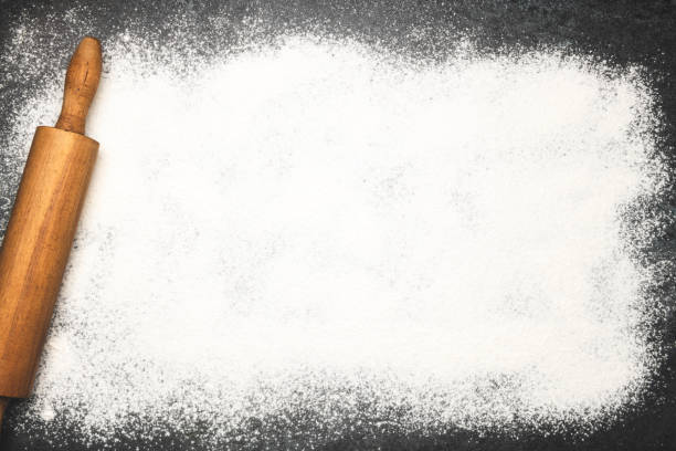 istock Baking background with the rolling pin and flour 1204594368