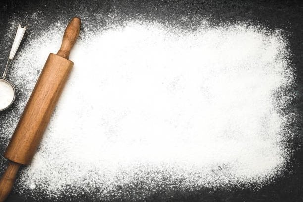 istock Baking background with the rolling pin and flour 1204594384
