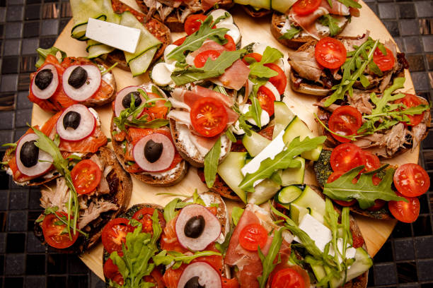 istock Various meat and vegetable snacks at event catering. 1204594395