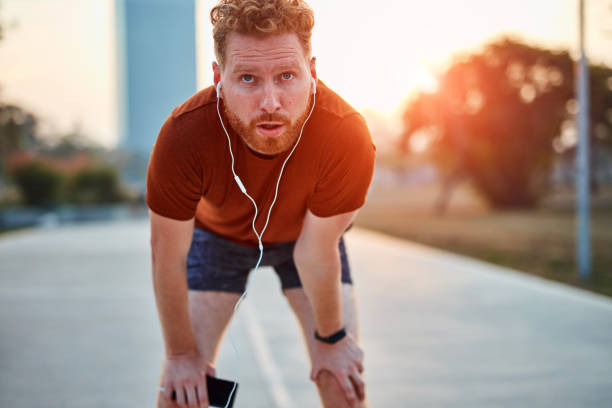 istock Modern young man working out in an urban park. 1204595961