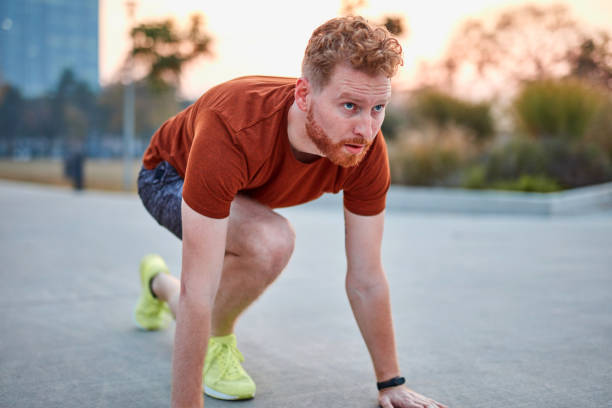 istock Young modern man jogging / exercising in an urban park. 1204597175