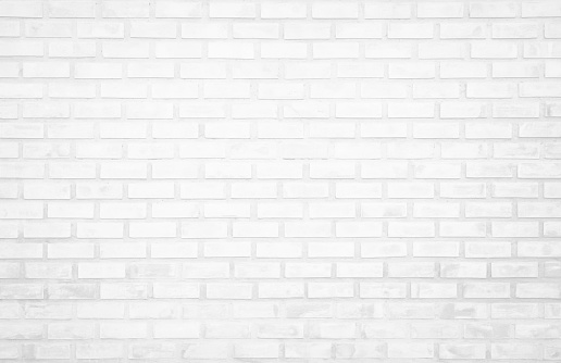 White brick wall texture background in room at subway. Brickwork stonework interior, rock old clean concrete grid uneven abstract weathered bricks tile design, horizontal architecture wallpaper.