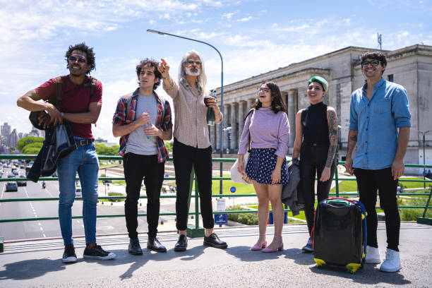 istock Professor teaching a group of students outdoors 1204600059
