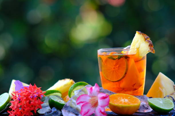 istock Fruit punch mocktails on wooden background 1204601324