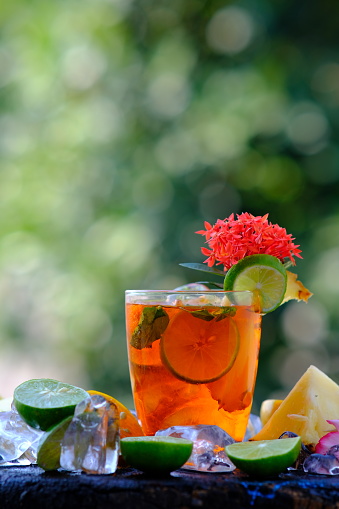 Fruit punch mocktails on green background