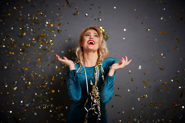 istock Screaming woman under shower of confetti 1204603012