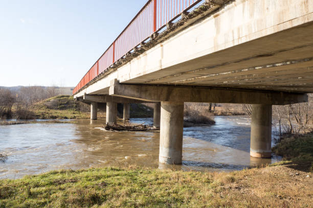 istock Automobile reinforced concrete bridge over a small river. Autumn landscape. 1204605299