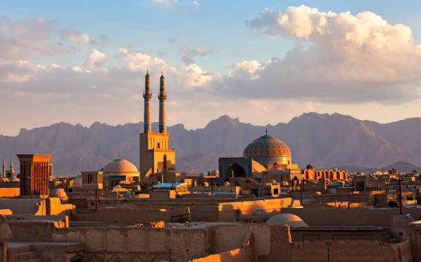 Skyline of the city of Yazd in Iran Sunset over the city of Yazd with the minarets and the dome of the Jameh Mosque, Iran iranian culture stock pictures, royalty-free photos & images