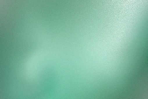 Light green metallic wall with copy space, abstract texture background