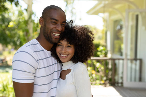istock Happy young couple smiling to camera 1204610357