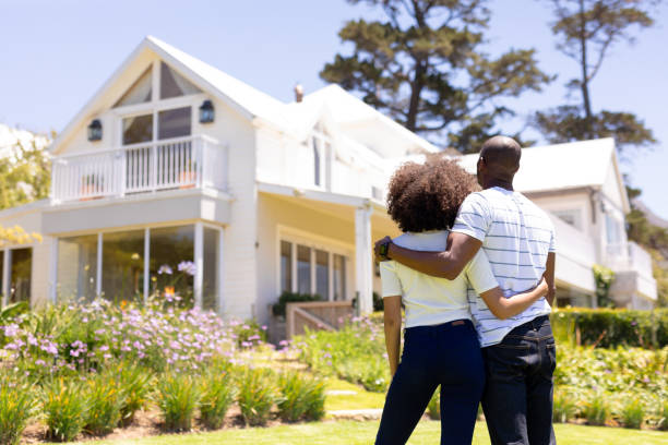 istock Young couple standing in the garden 1204610560