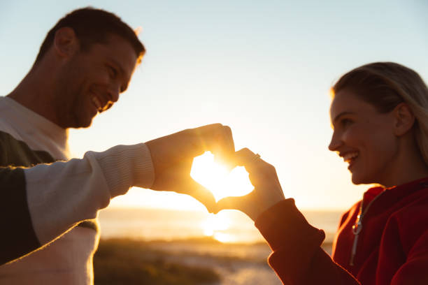 istock Couple in love at the beach 1204614135