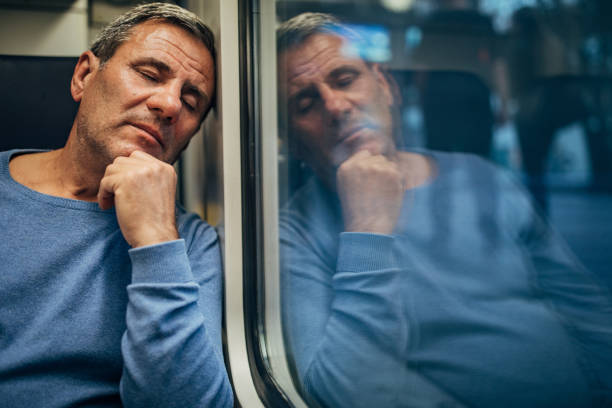 istock A male passenger sleeps on a train 1204614237