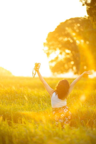 young woman at sunset