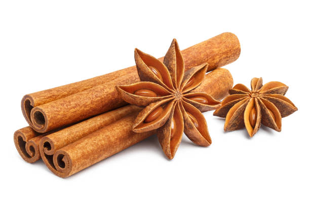 istock Delicious cinnamon sticks and star anise on white 1204615098
