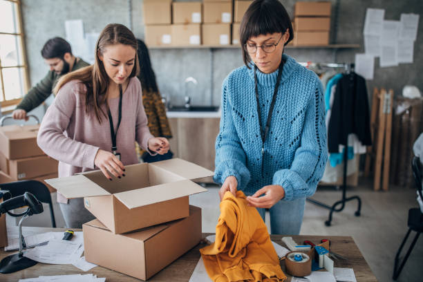 istock Diverse group of people arranging customers orders for drop shipping 1204615261