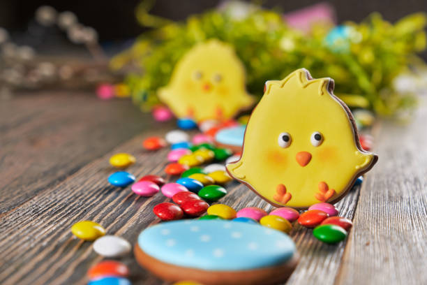 istock Colorful easter cookies on wooden table. 1204615349
