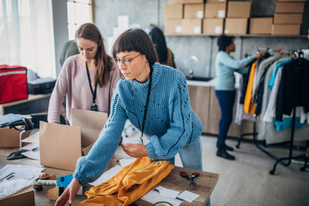 istock Diverse group of people arranging customers orders for drop shipping 1204615449