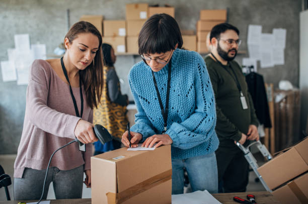 istock Diverse group of people arranging customers orders for drop shipping 1204615646