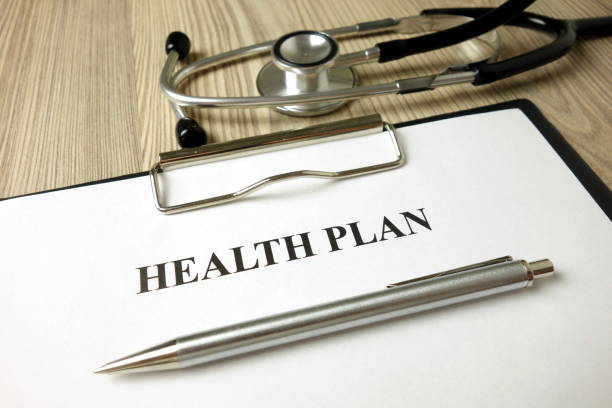 istock Health plan with pen and stethoscope 1204615926