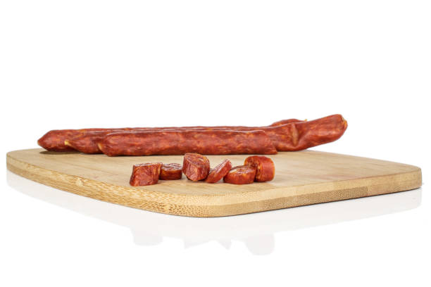 istock Smoked spicy sausage isolated on white 1204616082