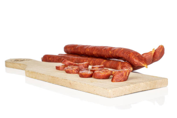 istock Smoked spicy sausage isolated on white 1204616109