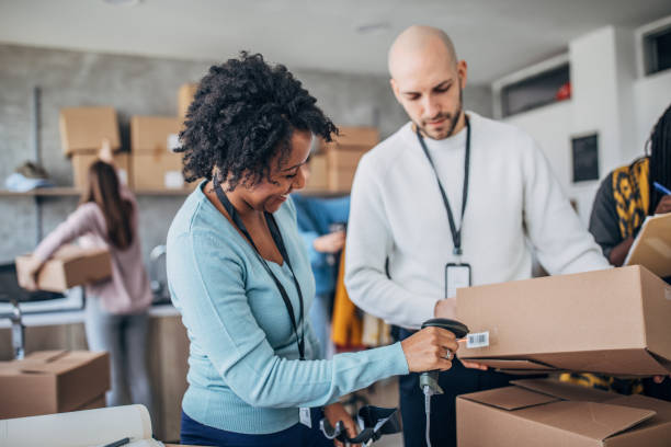 istock Diverse group of people arranging customers orders for drop shipping 1204616890
