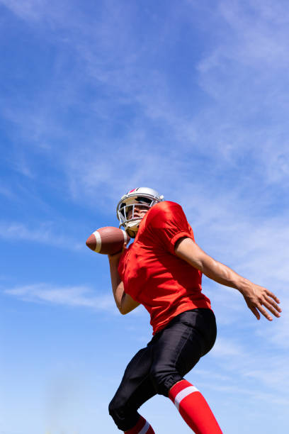 istock Football player with ball 1204616898