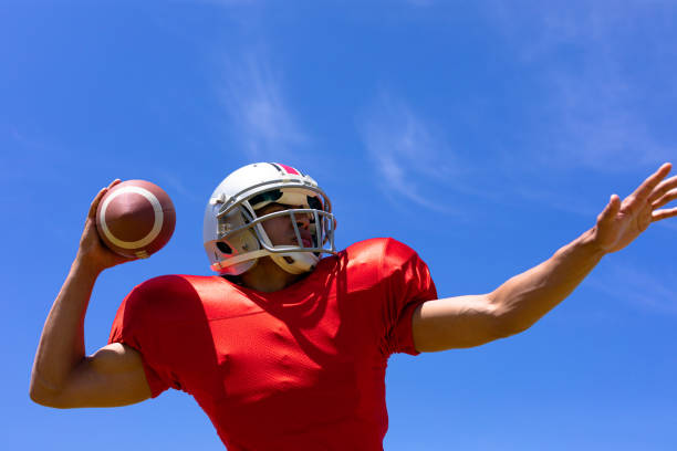 istock Football player with ball 1204616907