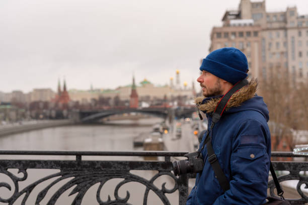 istock Tourist guy visits Moscow and crossing the bridge 1204616946