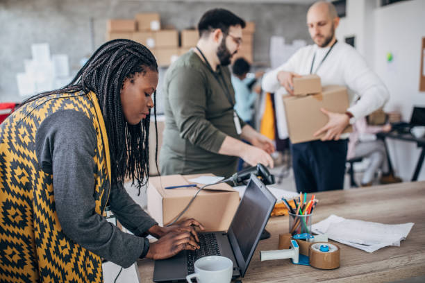 istock Diverse group of people arranging customers orders for drop shipping 1204617018