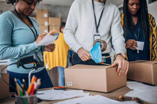 istock Diverse group of people arranging customers orders for drop shipping 1204617051