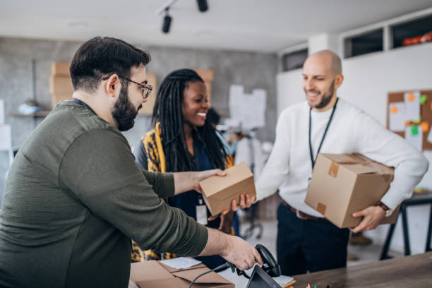 istock Diverse group of people arranging customers orders for drop shipping 1204617075