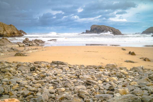 istock Cliffs and beach with strong waves and storm sky, Costa Quebrada, Spain 1204617125