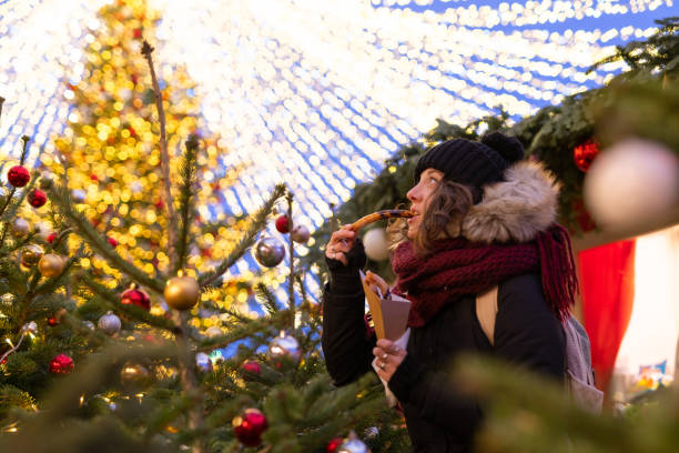 istock Lady eats Christmas cookies at the Red Square in Moscow 1204617184