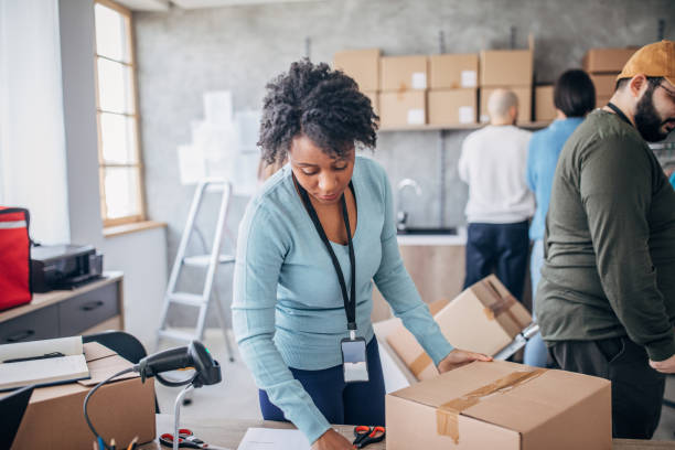 istock Diverse group of people arranging customers orders for drop shipping 1204617497