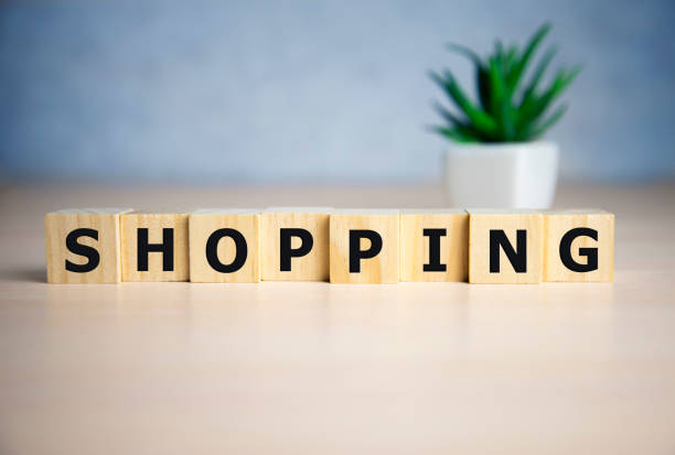 istock Shopping word, word cube with blue background 1204618277