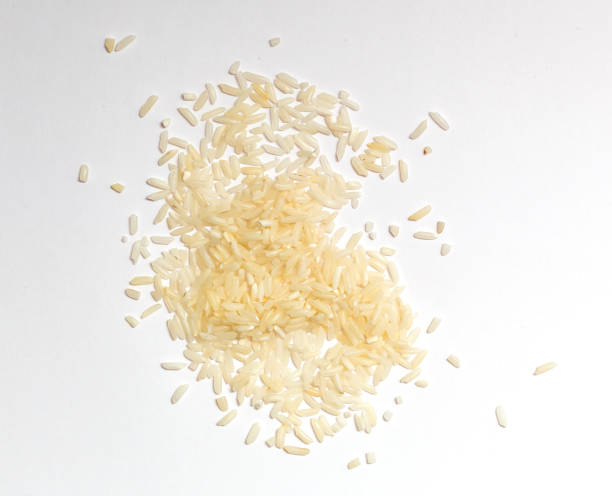 istock Pile of white glutinous rice isolated on white background. Top view. 1204618474