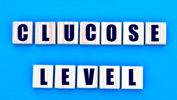 istock concept words glucose level on cubes on a blue background 1204619803