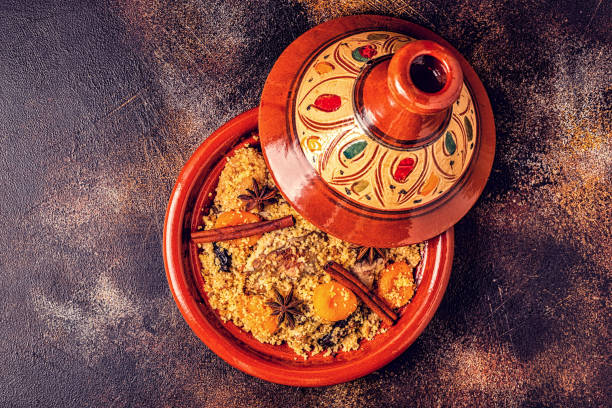 Traditional moroccan tajine of chicken with salted lemons, olives. Traditional moroccan tajine of chicken with salted lemons, olives. Top view. couscous stock pictures, royalty-free photos & images