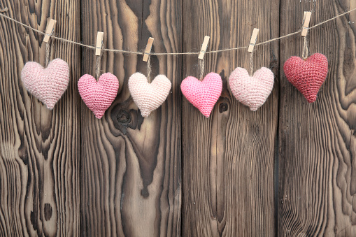 Valentine's day background empty copy space,hearts on wooden backdrop,romantic wallpaper,love concept.