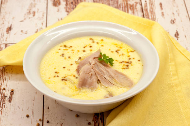 Thick creamy chicken soup. Soup with an egg. stock photo